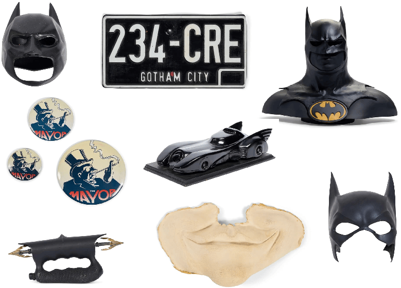 A collection of Batman memorabilia including a cape, a Gotham City license plate, buttons, a Batmobile model, a bust, and a mask.